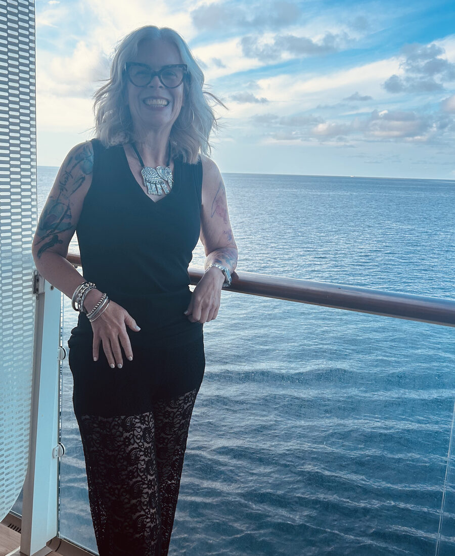Leah Rogers on a cruise ship balcony at sea